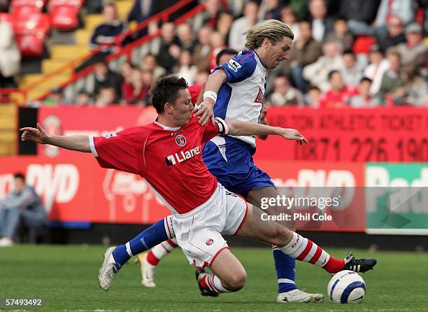 Robbie Savage of Blackburn is tackled by Charlton's Matt Holland during the Barclays Premiership match between Charlton Athletic and Blackburn Rovers...