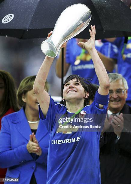 Ariane Hingst of Potsdam celebrates with the German Cup after winning the Women's DFB German Cup final between 1.FFC Turbine Potsdam and 1.FFC...