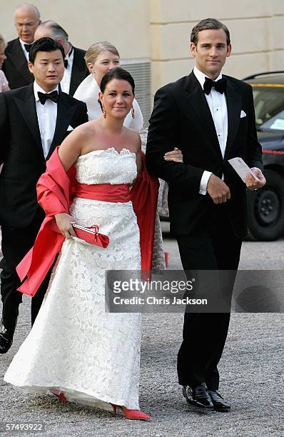 Jonas Bergstrom, boyfriend of Swedish Crown Princess Madeleine, arrives with Emma Pernald, girlfriend of Swedish Prince Carl Philip, for H.M. King...