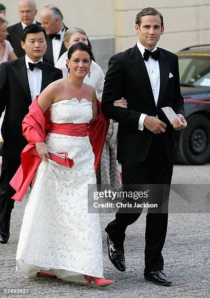 Jonas Bergstrom, boyfriend of Swedish Crown Princess Madeleine, arrives with Emma Pernald, girlfriend of Swedish Prince Carl Philip, for H.M. King...