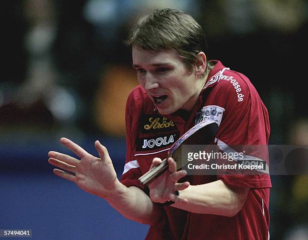 Werner Schlager of Austria looks frustrated to lose the match 1-3 against Ching Li of Honk Kong in the mens quarter finals during the sixth day of...
