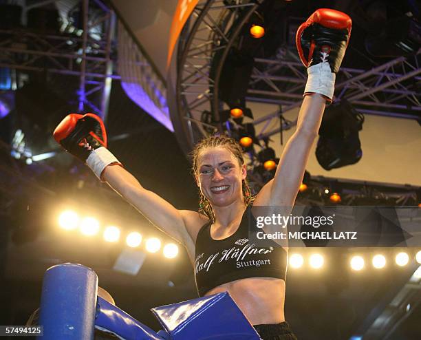 Super flyweight boxer Alesia Graf of Belarus celebrates after winning her GBU Super Flyweight title bout against Beatrix Farago of Hungary 29 April...