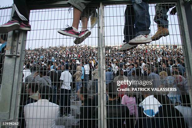 Olympique de Marseille's fans follow the game on a screen, 29 April 2006 at the Velodrome in Marseille, south of France, during the French cup final...