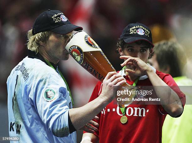 Oliver Kahn of Bayern Munich shares a beer with team mate Owen Hargreaves after winning the DFB German Cup final against Bayern Munich and Eintracht...