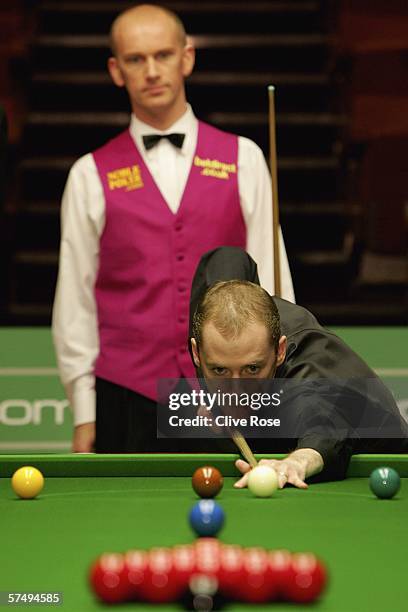 Graeme Dott breaks as final opponent Peter Ebdon looks on during the 888.com World Championship at the Crucible Theatre on April 29, 2006 in...