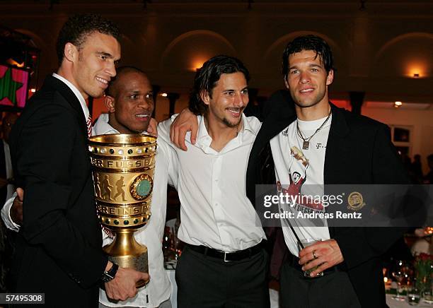 Valerien Ismael , Claudio Pizarro and Michael Ballack pose with the trophy during the Bayern Munich party after the German Cup final between Bayern...