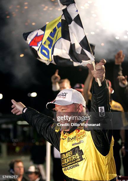 Todd Bodine, driver of the Lumber Liquidators Toyota, celebrates his victory at the Dodge Ram Tough 200 April 29, 2006 at Gateway International...