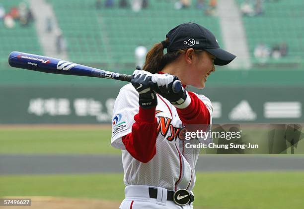 Golfer Michelle Wie reacts during the ceremonial batting for a baseball game between the Doosan Bears and SK Wyverns on April 30, 2006 in Incheon,...