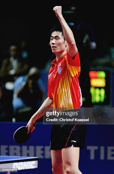 Liqin Wang of China celebrates his 3-2 victory against Timo Boll of Germany in the semifinal during the seventh day of the Liebherr World Team Table...