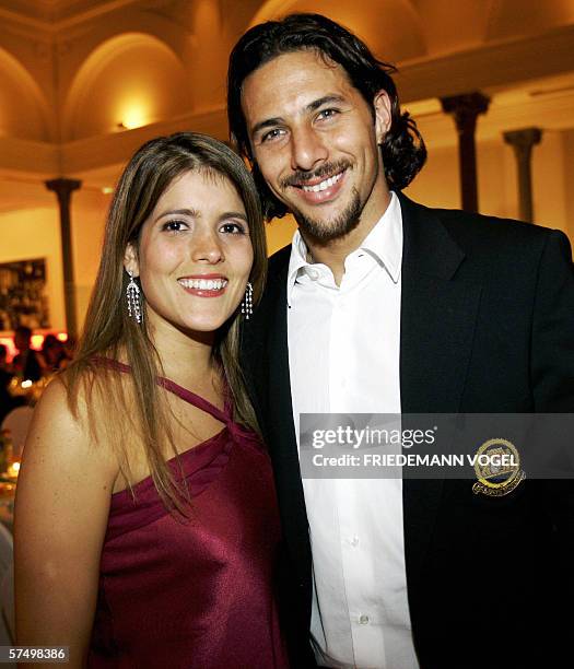 Claudio Pizarro and his wife Karla Salcedo pose for a photo during the Bayern Munich party after the German Cup final between Bayern Munich and...