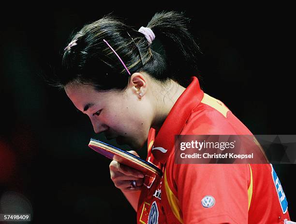 Nan Wang of China breath to his racket during the match against Sui Fei Lauf of Hong Kong in the womens final during the seventh day of the Liebherr...