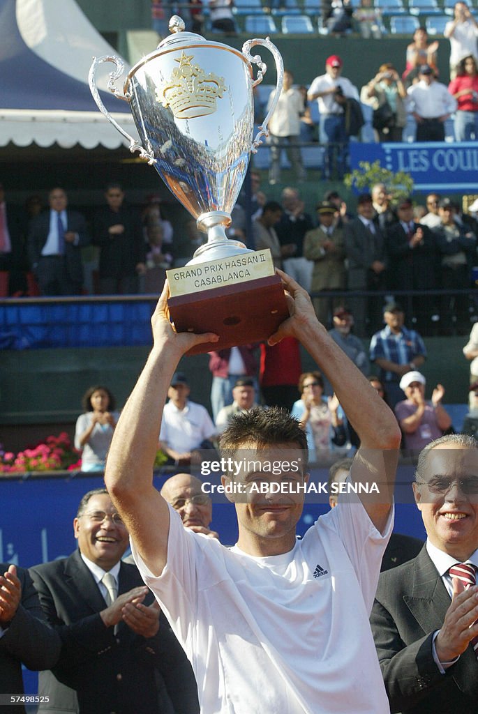 Italian Daniele Bracciali holds his trop