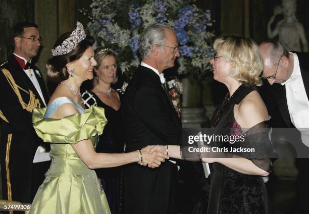 King Carl Gutaf XVI and Queen Silvia greet guests as they arrive for the Gala Dinner at Royal Palace to celebrate King Carl XVI Gustaf of Sweden's...