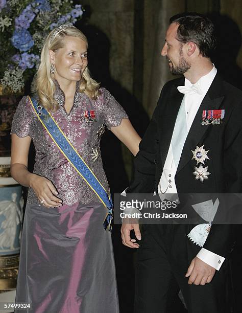 Princess Mette-Marit and Prince Haakon of Norway are seen as they arrives for a Gala Dinner at the Royal Palace to celebrate King Carl Gustaf XVI of...