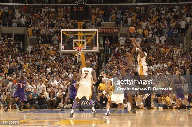 Kobe Bryant of the Los Angeles Lakers shoots the buzzer beating game winning shot in overtime against the Phoenix Suns in game four of the Western...