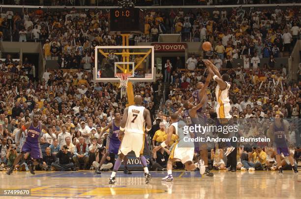 Kobe Bryant of the Los Angeles Lakers shoots the buzzer beating game winning shot in overtime against the Phoenix Suns in game four of the Western...