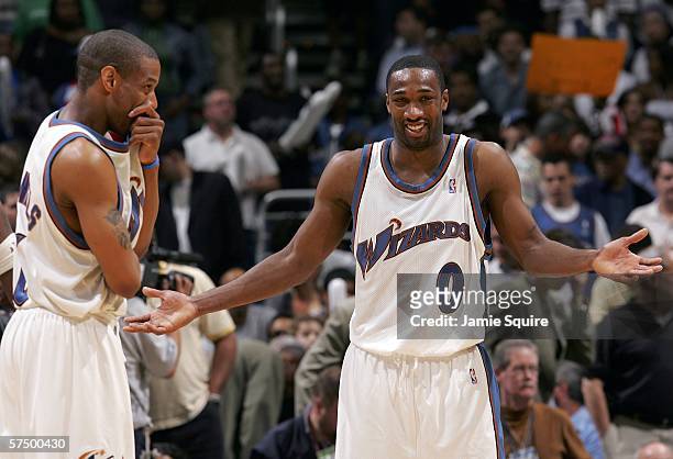 Gilbert Arenas and Antonio Daniels of the Washington Wizards react during game four of the Eastern Conference Quarterfinals against the Cleveland...