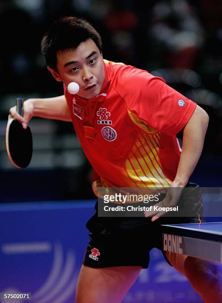 Hao Wang of China serves against Sang Eun Oh of South Korea during the men's final at the last day of the Liebherr Team Table Tennis Championships at...