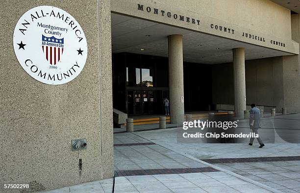 Pedestrian walks toward the Montgomery County Justice Center as jury selection begins in the second trial of sniper John Allen Muhammad May 1, 2006...