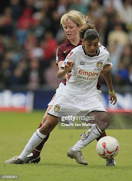 Leanne Champ of Arsenal tries to tackle Alex Scott of Leeds during the Womens FA Cup Final match between Leeds United Ladies v Arsenal Ladies at the...