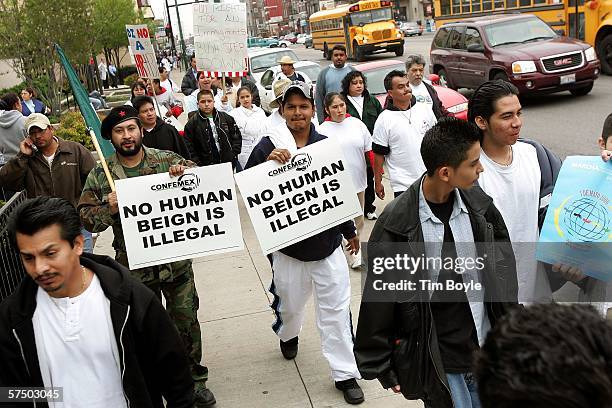 Demonstrators march in Pilsen, a largely Hispanic area of Chicago, Illinois May 1, 2006. Immigrants and their supporters around the nation are...