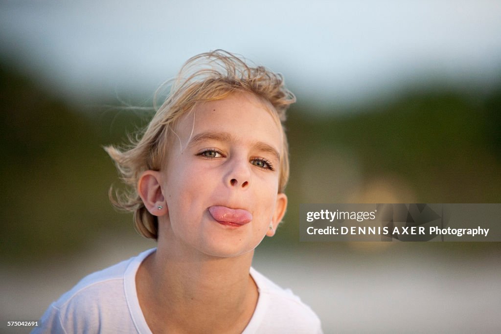 Young girl sticking out her tongue