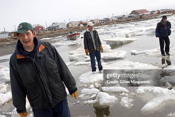 Out late on a Friday night, teenage Inupiat Eskimos go ice-hoping on the Chukchi Sea at 1 am, one of the rare distractions in Shishmaref, June 10,...