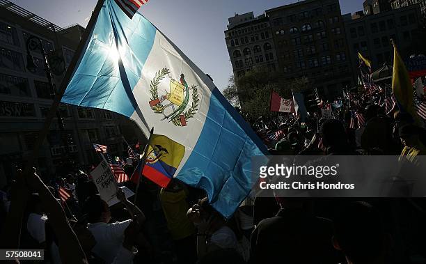 Protestor brandishes the flag from Guatemala during a pro-immigration rally in Union Square May 1, 2006 in New York City. Activists and immigrants...