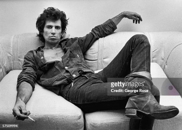 Guitarist Keith Richards of the Rolling Stones, lounges in his New York City, New York, office during a 1980 portrait session.