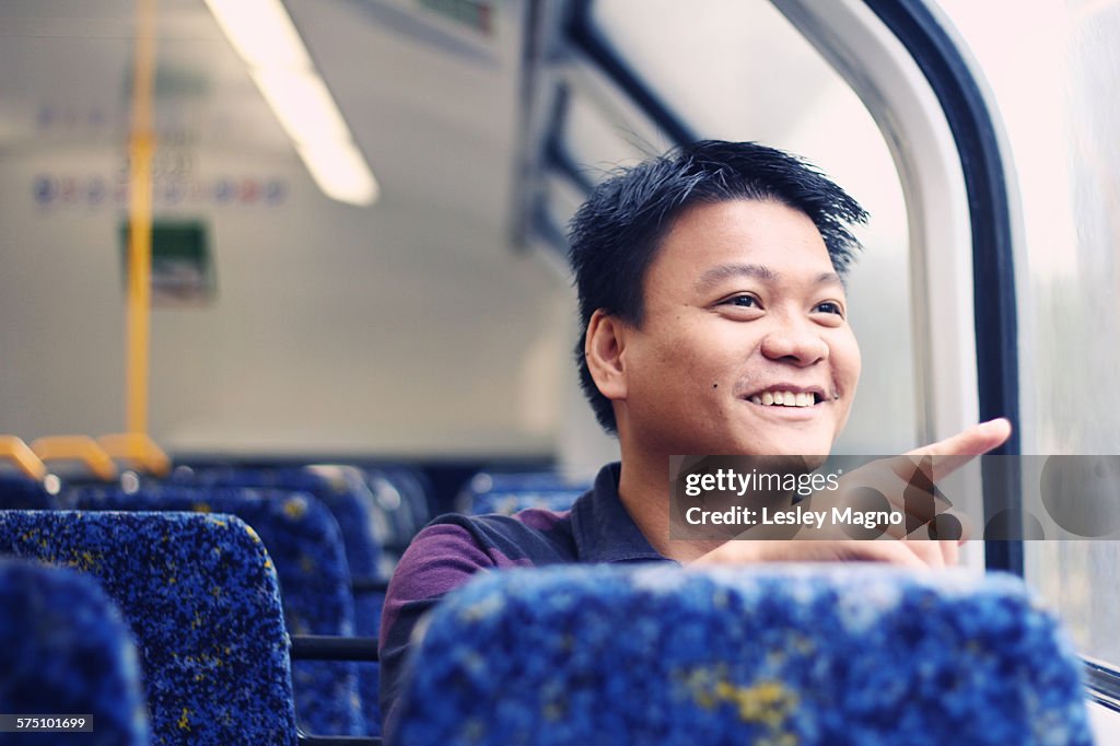 30-35 year old Asian-Filipino man at Sydney train