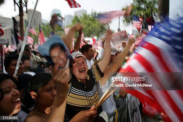 People march and rally on what is being dubbed a "Day Without Immigrants" or the "Great American Boycott" day on May 1, 2006 in Los Angeles,...