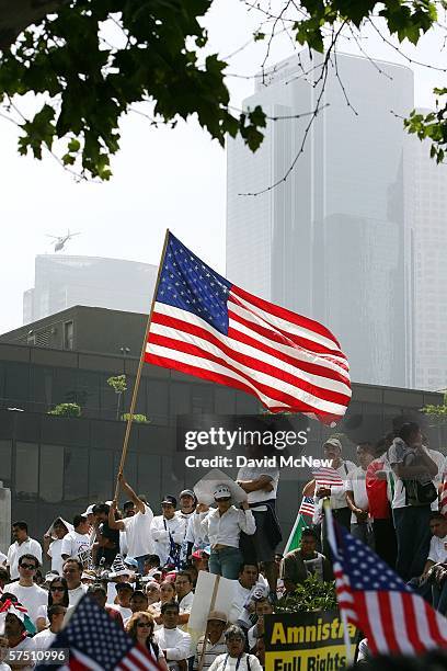 People march and rally on what is being dubbed a "Day Without Immigrants" or the "Great American Boycott" day on May 1, 2006 in Los Angeles,...