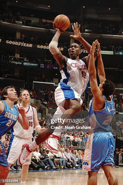 Elton Brand of the Los Angeles Clippers shoots against Andre Miller of the Denver Nuggets in game five of the Western Conference Quarterfinals during...