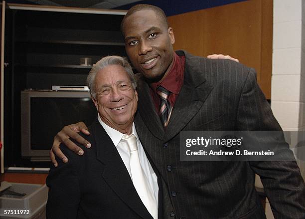 Elton Brand of the Los Angeles Clippers embraces Clippers Owner Donald Sterling after the win against the Denver Nuggets in game five of the Western...
