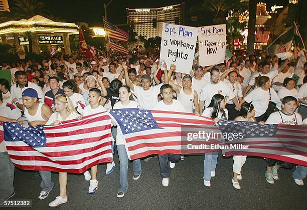 People march down the Las Vegas Strip in support of immigrant rights as part of a "Day Without Immigrants" on May 1, 2006 in Las Vegas, Nevada. An...