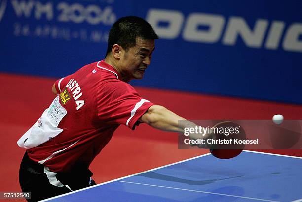 Weixing Chen of Austria plays a backhand against Ching Li of of Honk Kong int the mens quarter-final during the sixth day of the Liebherr World Team...