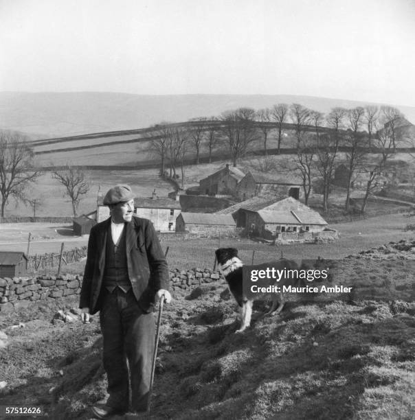 Shepherd and his dog on a farm in Lancashire, 1955. Original publication: Picture Post - 7794 - What Hope In The Hills? - pub. 4th June 1955