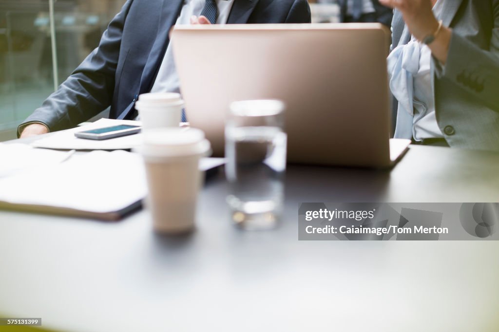 Business people working at laptop