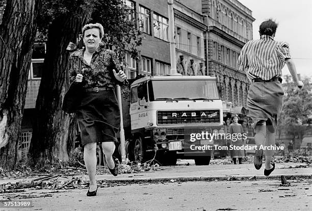 Women run for their lives across 'Sniper Alley' under the sights of Serb gunmen during the siege of Sarajevo.