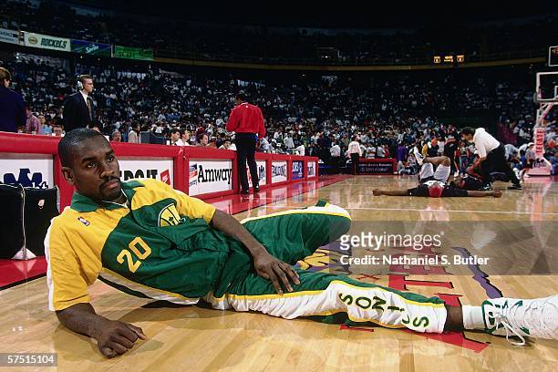 Gary Payton of the Seattle Supersonics stretches prior to the game against the Los Angeles Clippers during the 1994 NBA Challenge at the Palacio de...