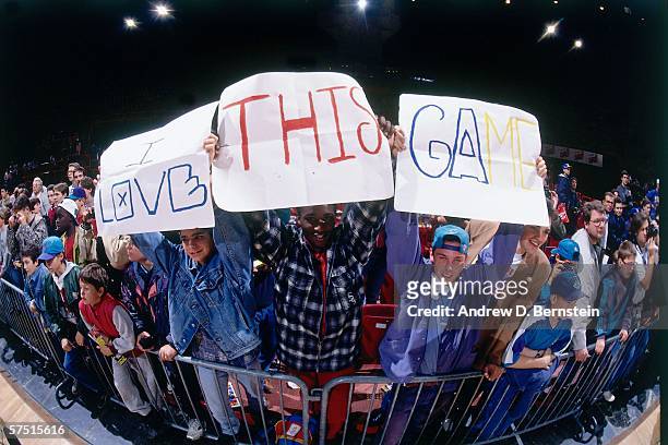 Fans hold signs during the 1994 Europe Tour between the Golden State Warriors and Charlotte Hornets played at the Palais Omnisports de Bercy on...