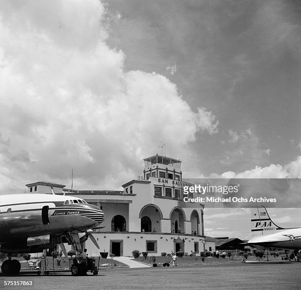 View of a Pan American Airways DC-4 Clipper plane on the tarmac in San Salvador, El Salvador.