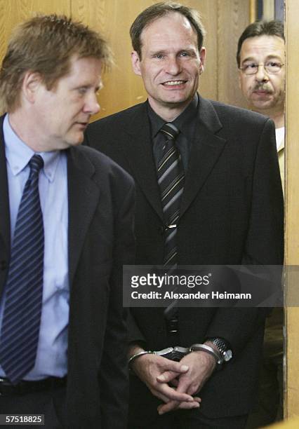 Germany's self-confessed cannibal Armin Meiwes enters, accompanied by his lawyer Harald Ermel , the courtroom, for his retrial for murder, on 03 May...