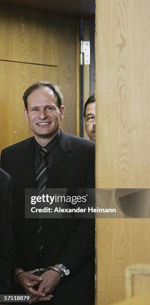 B Germany's self-confessed cannibal Armin Meiwes enters the courtroom for his retrial for murder, on 03 May 2006 at court in Frankfurt, Germany, in...