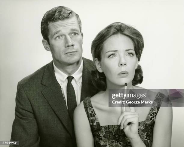 couple in studio, looking thoughtful, posing (b&w), portrait - 1950s couple stock pictures, royalty-free photos & images