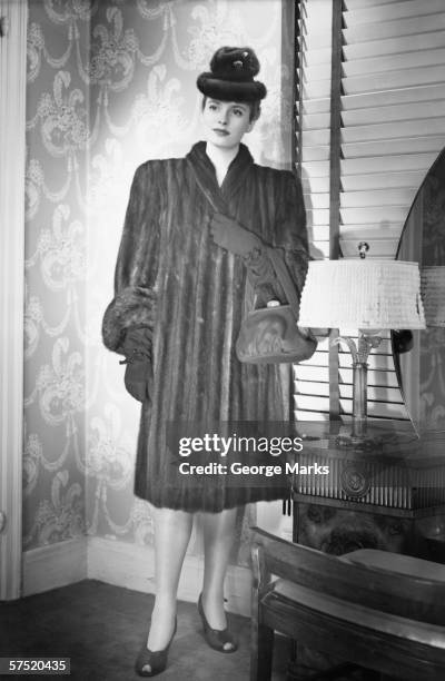 fashionable woman in mink coat and hat standing in anteroom, (b&w), portrait - mink fur stock pictures, royalty-free photos & images