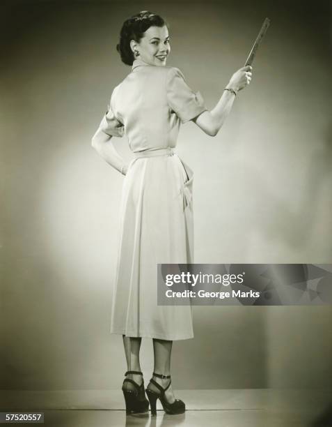 woman holding ruler in studio, portrait - teacher pointing finger stock pictures, royalty-free photos & images