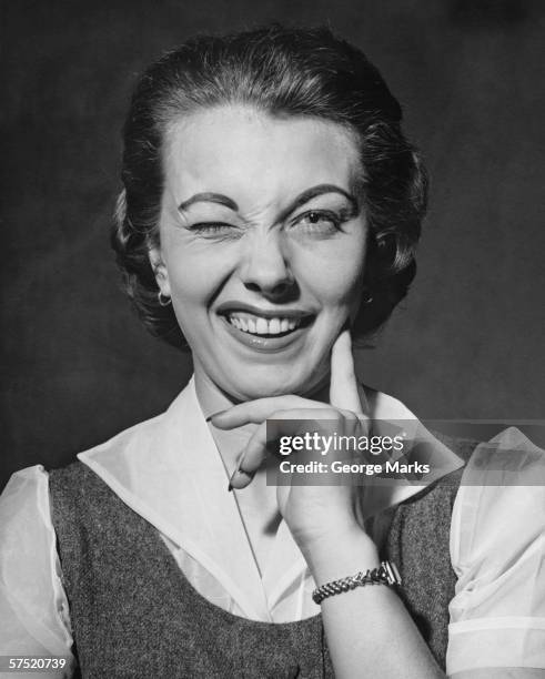 woman winking in studio, (b&w), portrait - winking eye stock pictures, royalty-free photos & images