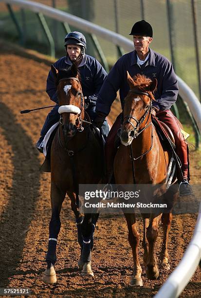 Kentucky Derby hopeful, Barbaro, ridden by exercise rider, Peter Brette , is led by trainer, Michael Matz , during morning workouts in preparation...