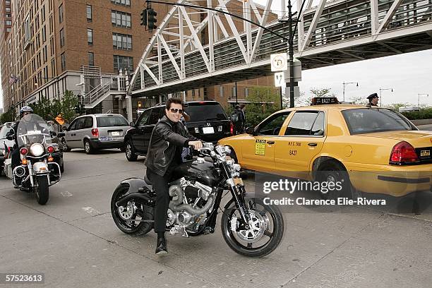 Actor Tom Cruise rides a motorcycle the West Side highway enroute to the premiere of "Mission Impossible III" at the Tribeca Performing Art Center...